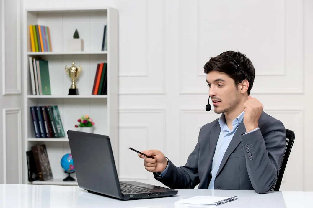 customer-service-cute-guy-grey-suit-with-computer-headset-holding-fists-up_140725-164143