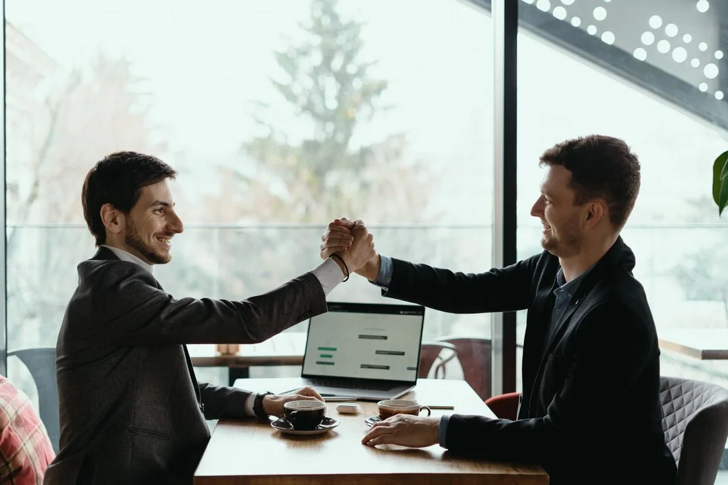 two-business-men-celebrating-deal_158595-5256